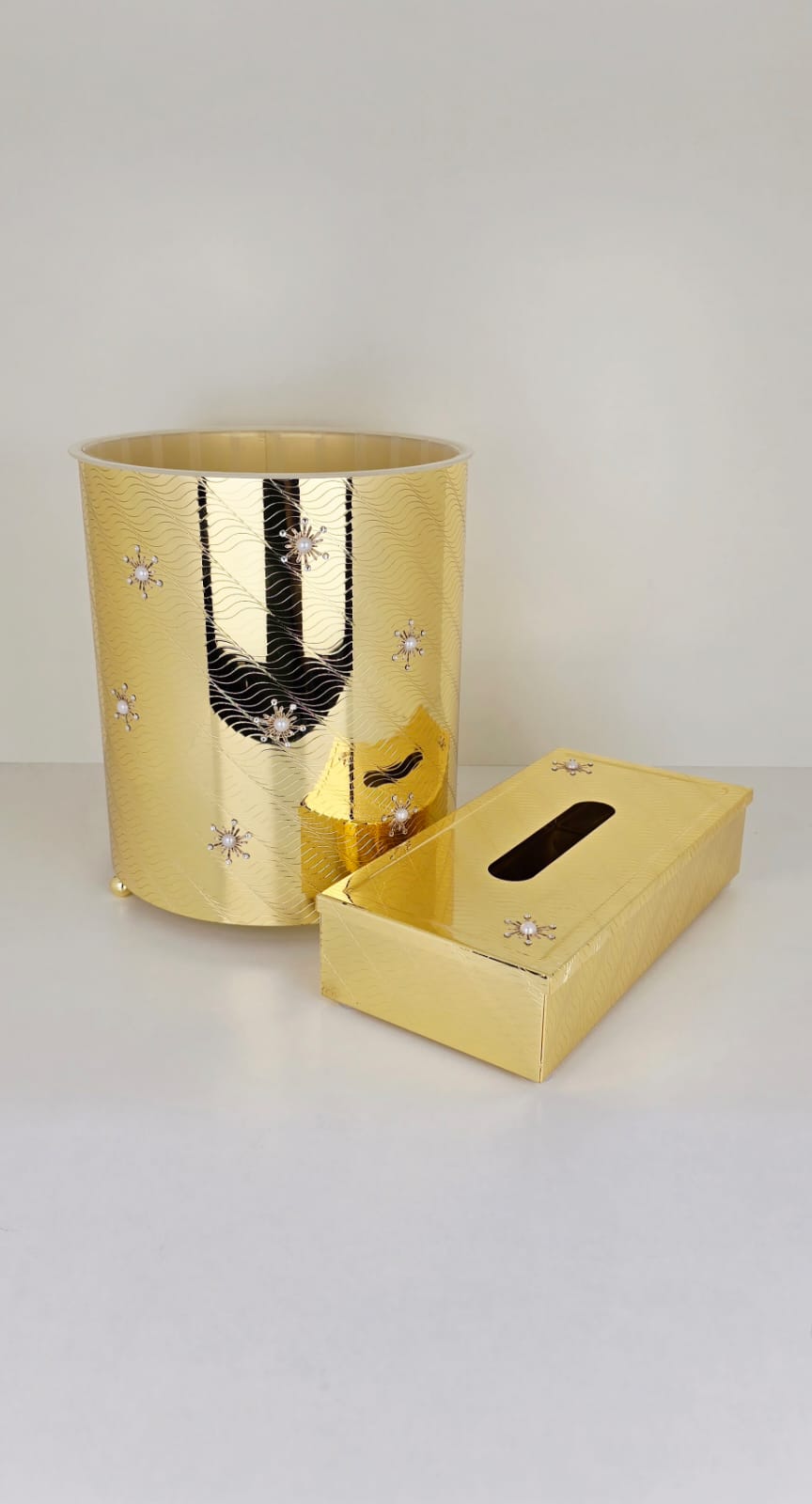 Golden tissue box and bakset with stone work